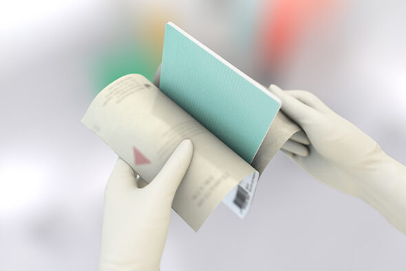 Person opens the inner packaging of a Cutimed Siltec Sorbact dressing