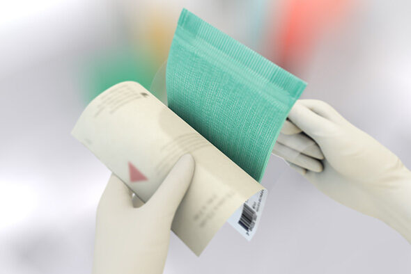 Person opens the inner packaging of a Sorbact Absorption dressing