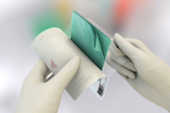 Person opens the inner packaging of a Sorbact Compress dressing