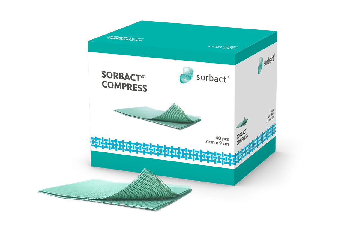 Packaging of Sorbact Compress with a dressing beside it