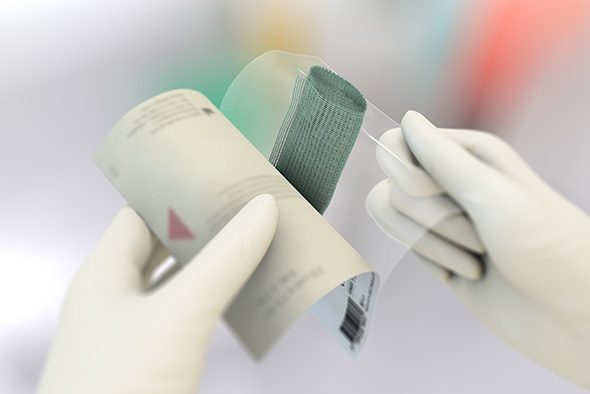 Person opens the inner packaging of a Sorbact Ribbon dressing