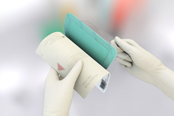 Person opens the inner packaging of a Sorbact Superabsorbent dressing