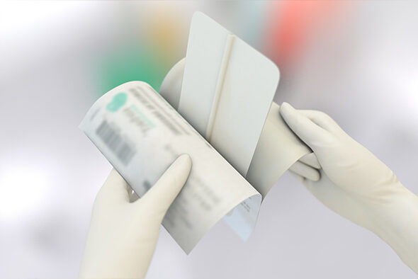 Person opens the inner packaging of a Sorbact Surgical Dressing